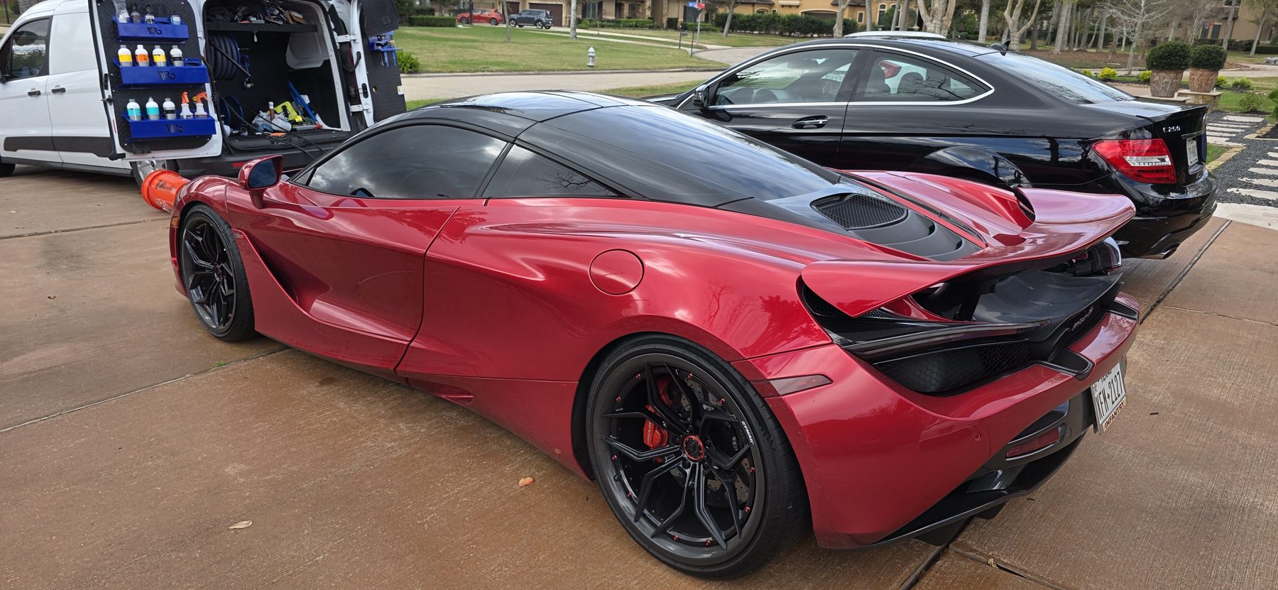Glaze Auto Detailing mobile setup beside a detailed red sports car